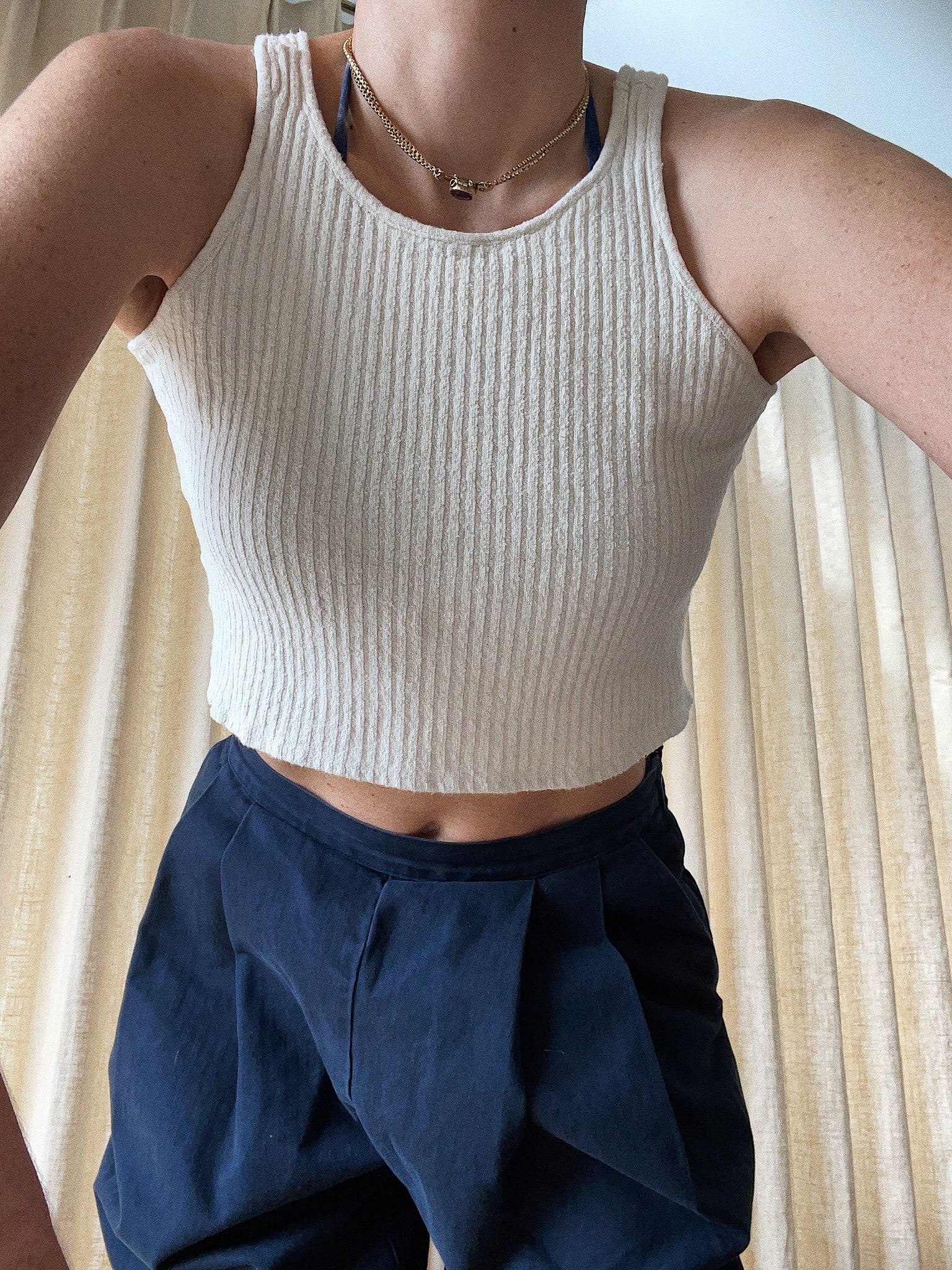 certified organic cotton and hemp tank top in off white color made ethically. cropped tank top in this photo. Ribbed cropped tank top in off white.